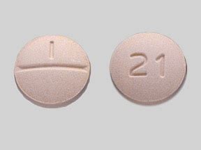If you do not find a match, call your doctor or pharmacist. . Round peach colored pill 1 2